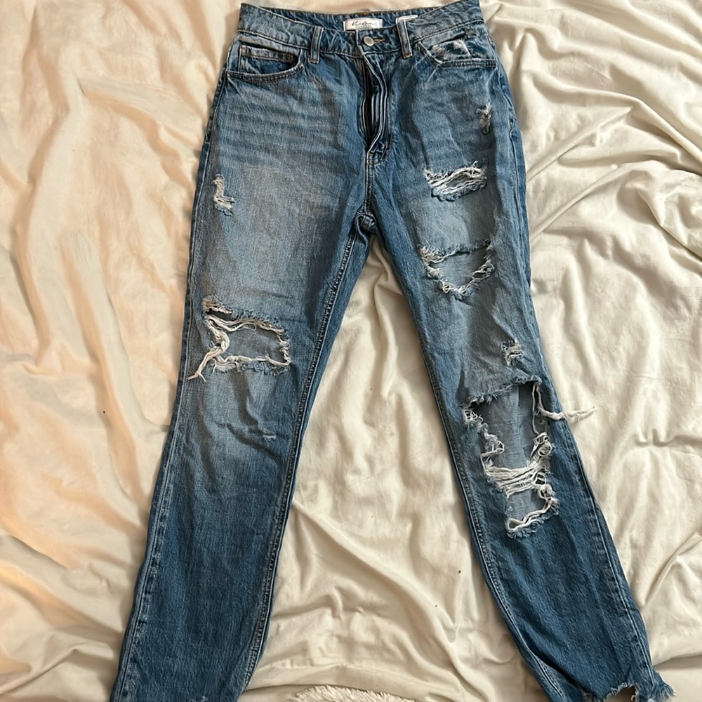 A high waisted straight leg jean. Size 25 in the waist.